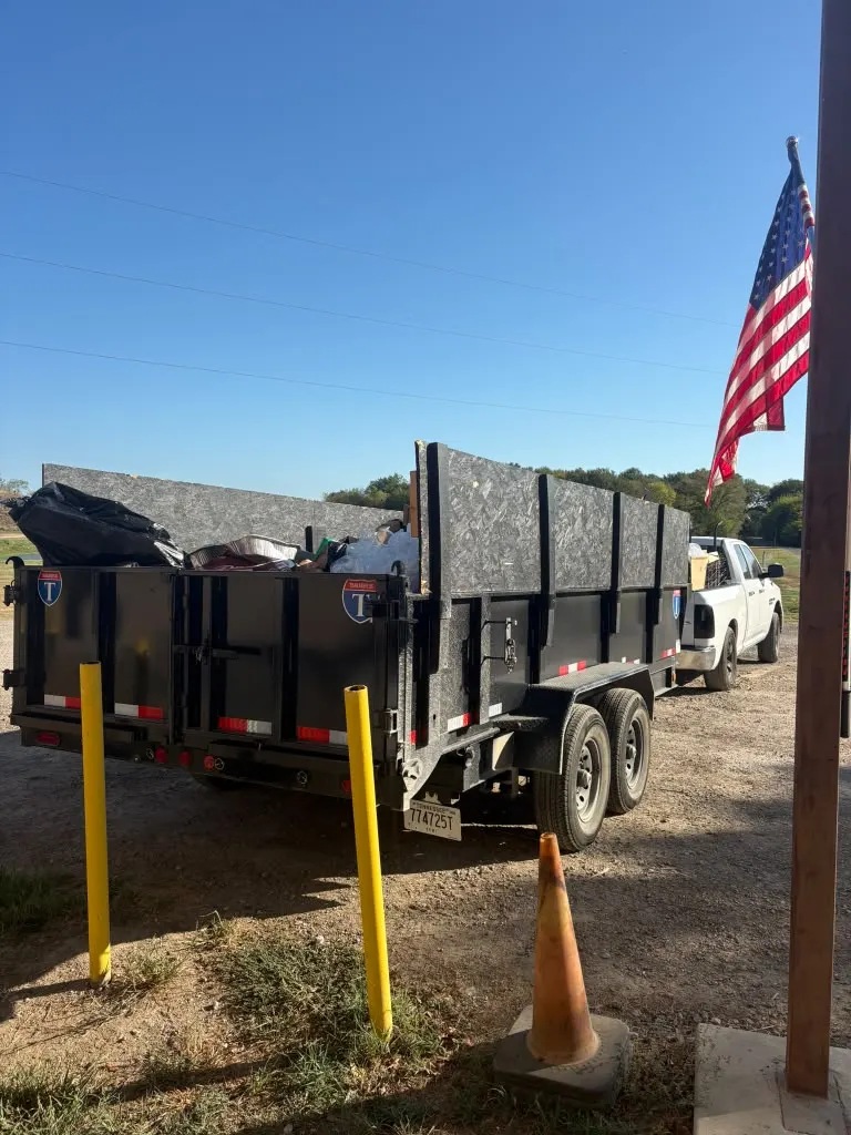 Dumpster trailer parked at a business building